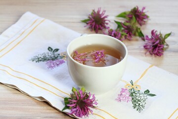 Cup of herbal tea from Monarda didyma flower head and leaves with cinnamon. Sweet smelling tea with...