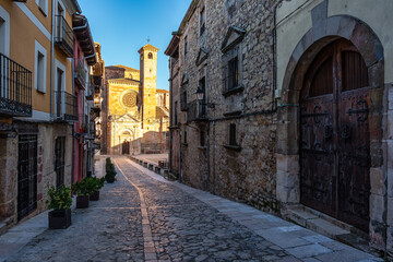 Fototapeta na wymiar Main street leading up from the cathedral to the medieval castle in the old town of Siguenza, Spain.
