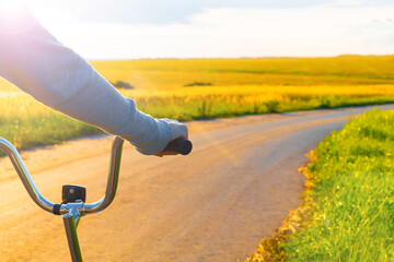 girl riding a bike on a country road.