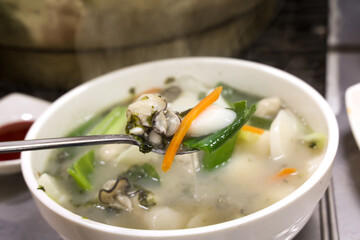 Korean food. oyster rice cake soup