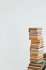 Stacks of educational books in university library on white background