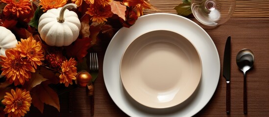 Bird's-eye view of fall-themed table setting with white pumpkin.