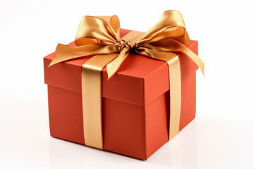 Fototapeta premium An orange present wrapped with ribbon, isolated on a solid white background