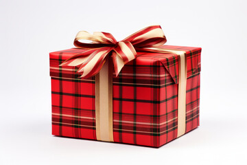 A Christmas package wrapped with ribbon, isolated on a solid white background