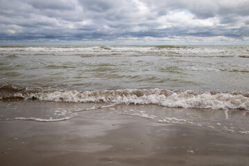 Enchanting Coastal Scene with Stormy Skies and Waves on the Seashore