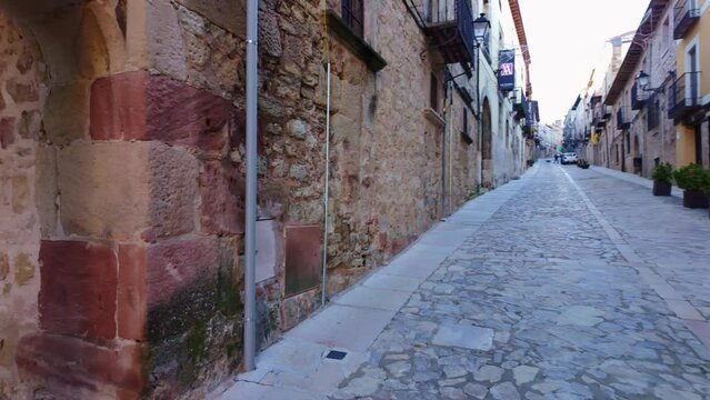 Plaza Mayor of the medieval town of Siguenza with stone arches and columns, Spain
