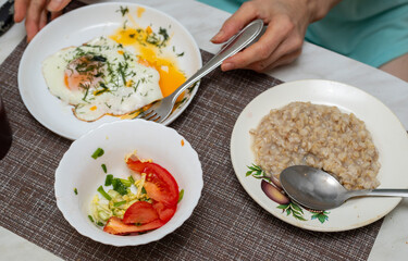 Breakfast, salad, oatmeal for breakfast on the table