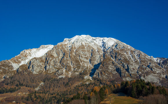 A beautiful view of the snowy mountains of the Alpago from San Martino
