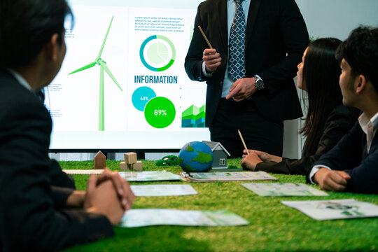 Businessman leader give presentation on eco-friendly implementation in order to reduce CO2 emission and make sustainable ecology for greener future with renewable alternative energy technology. Quaint