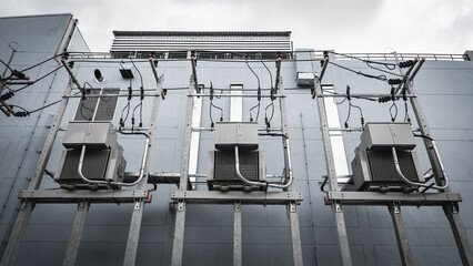 Electrical power and distribution electricity system at the building wall.