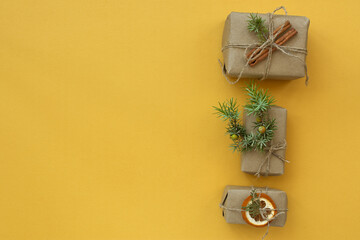 Zero waste Christmas concept. Natural gift materials paper fir branches dried citrus cinnamon on a...