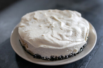 Classic banoffee pie a simple cookie crust is filled with thick caramel, slices of fresh banana and whipped cream on top. 