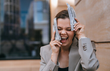 Excited. Woman screaming eyes closed covers face by us collar banknotes celebrating  financial...