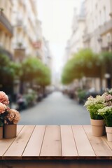 Beautiful blooms in rustic pots on a table with a sunny Paris street in soft focus, evoking a serene, inviting mood