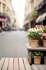 Fototapeta na wymiar Beautiful blooms in rustic pots on a table with a sunny Paris street in soft focus, evoking a serene, inviting mood