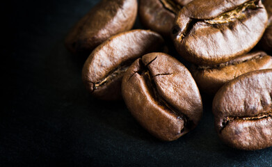 coffee beans on a stone black board background, close up