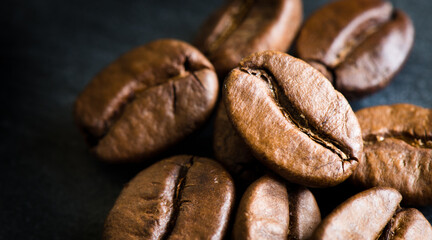 coffee beans on a stone black board background, close up