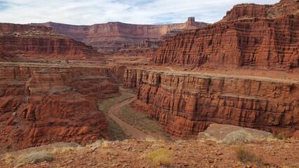 This awe-inspiring photo captures the vast and rugged beauty of a canyon in Moab, Utah. The red...