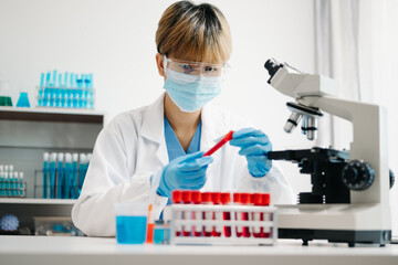 Scientist mixing chemical liquids in the chemistry lab. Researcher working in laboratory