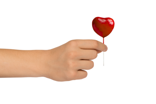 Male hand holds decorative red heart with the index finger and thumb. Love and Valentine's Day. PNG isolated on transparent background. Medicine and cardiology - I will give you a new heart.