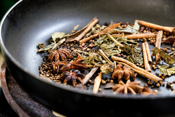 spices in a pan, A spice is a seed, fruit, root, bark, or other plant substance primarily used for...
