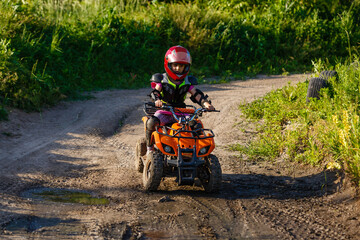Girl riding an electric quad bike