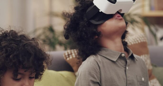 Child, virtual reality and glasses for futuristic entertainment, live streaming or games. Boys, headset and metaverse media on sofa in home as creative innovation or education, online or connectivity