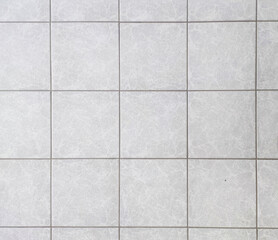  High angle view of grey tiles texture background.