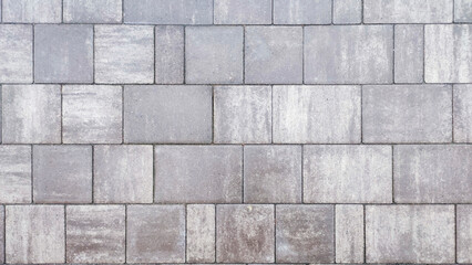  Close-up surface of gray paving stones road texture background.