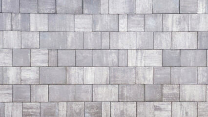  Closeup of a gray textured surface made from paving stones.