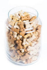 Bones for dogs, delicacy treats in jar isolated on white background.