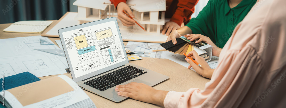 Poster cropped image of interior designer team discuss the material color while laptop displayed website wi