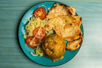 Mashed plantains with grilled chicken