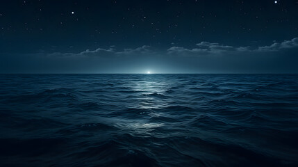 Fototapeta na wymiar Moonlight reflecting on the calm ocean surface at night.