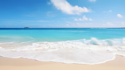 Ocean waves gently lapping on a tropical beach with clear blue sky.