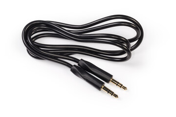 Analog audio cable with mini stereo connectors on white surface