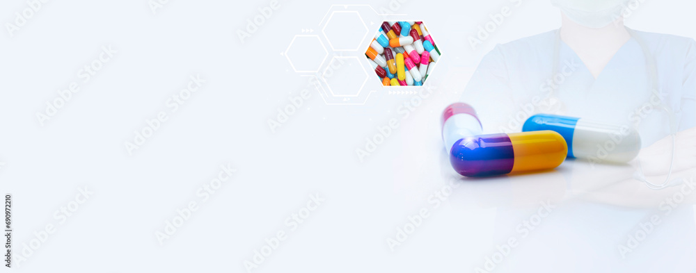 Wall mural antibiotic capsule pills and prescription drugs banner with doctor and stethoscope background. healt