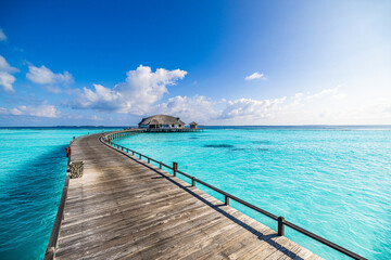 Best travel landscape. Exotic sunny island sea bay wooden pier and water villa over pristine lagoon...