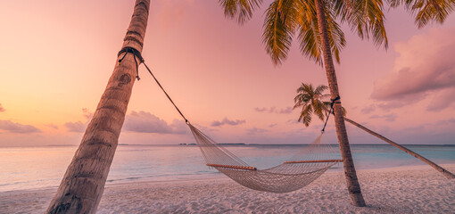 Relax vacation leisure lifestyle on exotic tropical island beach, palm tree hammock hanging calm sea. Paradise beach landscape panoramic sunrise sky clouds amazing reflections. Beautiful nature banner - obrazy, fototapety, plakaty