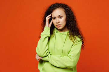Young sad minded pensive mistaken woman of African American ethnicity she wear green hoody casual...