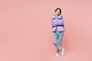 Full body young smiling happy woman wear purple vest sweatshirt casual clothes looking camera hold...