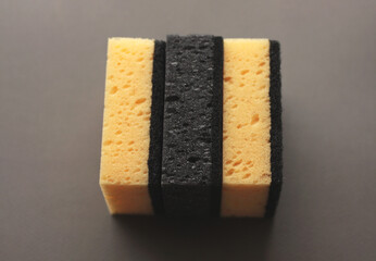 Cleaning sponges on a gray background. Cleaning concept, cleaning service.Top view