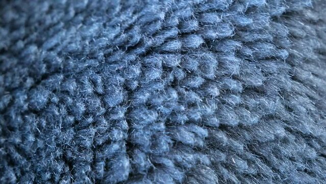 Details of fir mahr woolen fabric. textile background. Woolen Texture Background, Knitted Wool Fabric, Hairy Fluffy Textile.