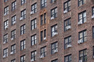 Fototapeta na wymiar Air conditioners on house facade