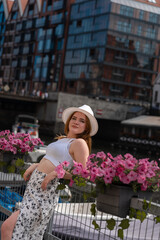 Fototapeta premium girl in a white hat on the background of the city of Gdansk Poland Europe
