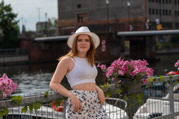 Fototapeta premium girl in a white hat on the background of the city of Gdansk Poland Europe