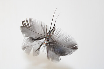 Handgemachter Schmetterling aus Federn