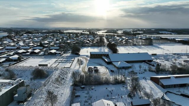 Small snow-covered city in the sun in Denmark