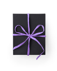 Top view of black gift box with violet paper ribbon isolated on white background