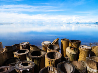 Bamboo fence and blue sky sea view.